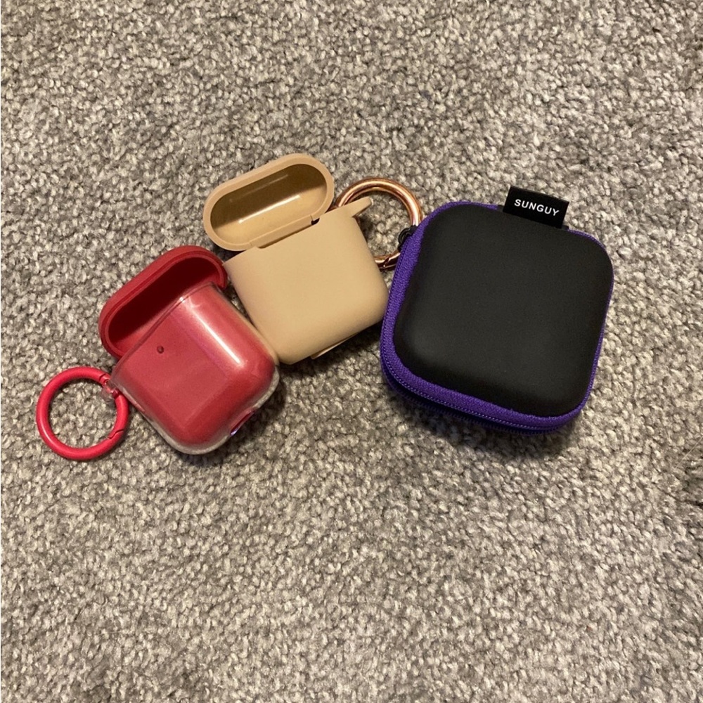 Three air pod first generation cases
